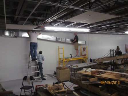 A HVAC duct had to be relocated from the center to the side of the main room.