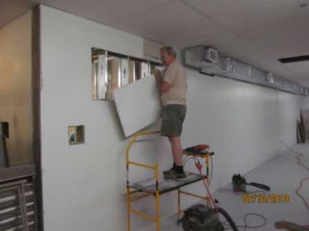 Cutting a window opening for the dispatch office.