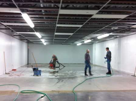 Floor being cleaned prior to painting.